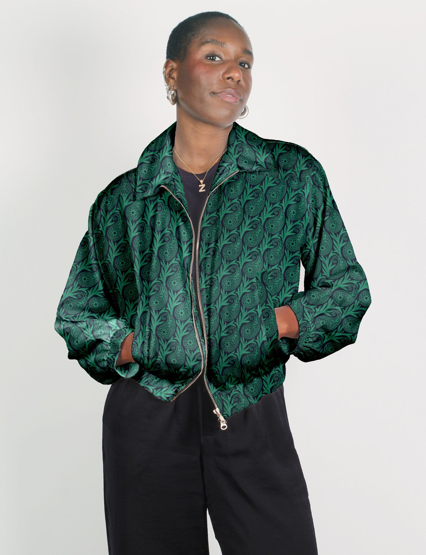 Upcycled Bomber Jacket made from recycled sari materials, featuring a cute cropped shape, elasticated hem and cuffs, and contrast sari print lining. Sustainable apparel promoting eco-friendly fashion and ethical clothing.
