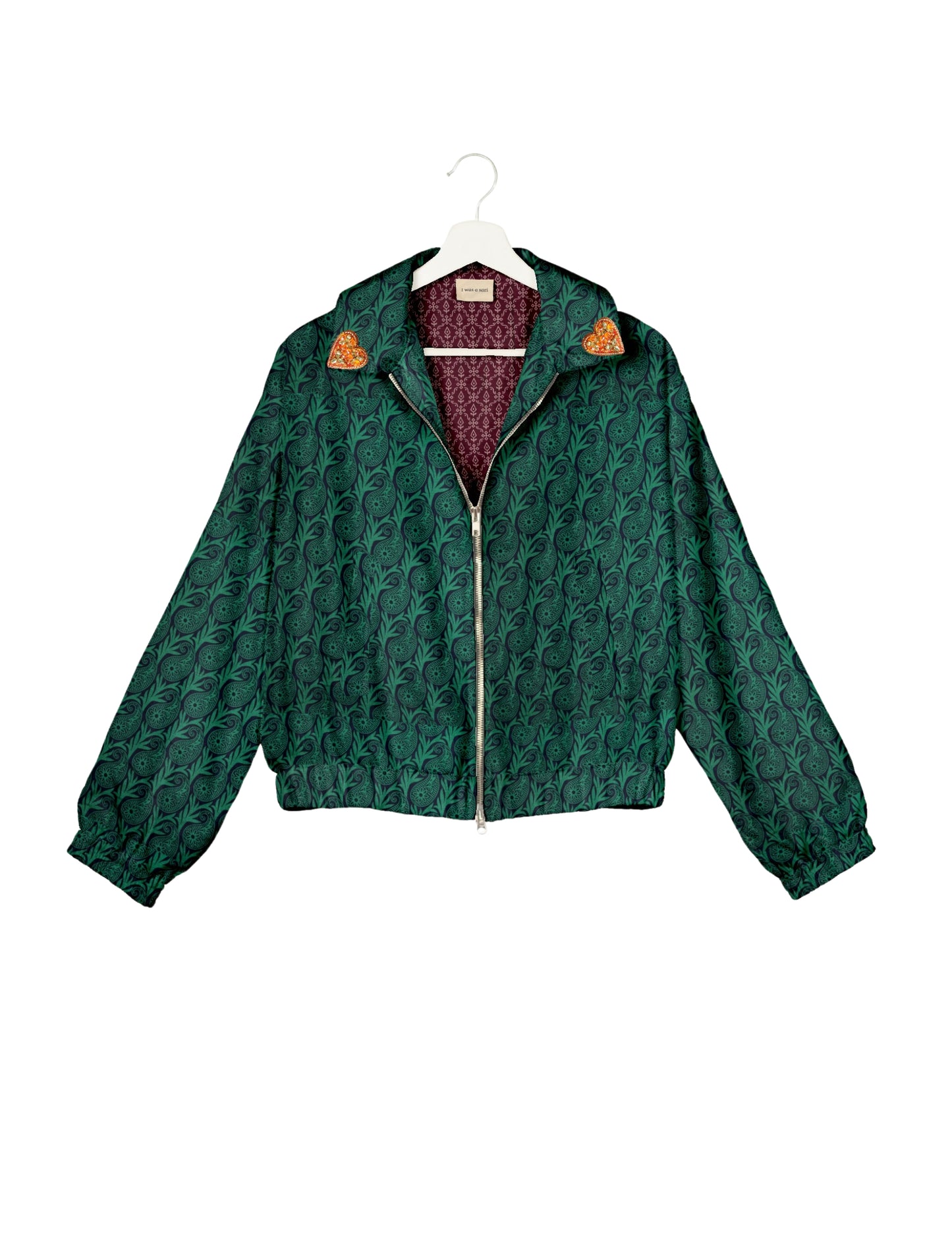 Make a bold statement with our Heart Drop Earrings, a symbol of conscious luxury and ethical fashion. Handcrafted using the intricate Aari embroidery technique, these earrings are made from upcycled sari fabric, embracing slow fashion and zero waste clothing. Elevate your look with sustainable apparel that supports fair trade fashion while reducing textile waste. Choose eco-friendly fashion that speaks of love, artistry, and responsibility.