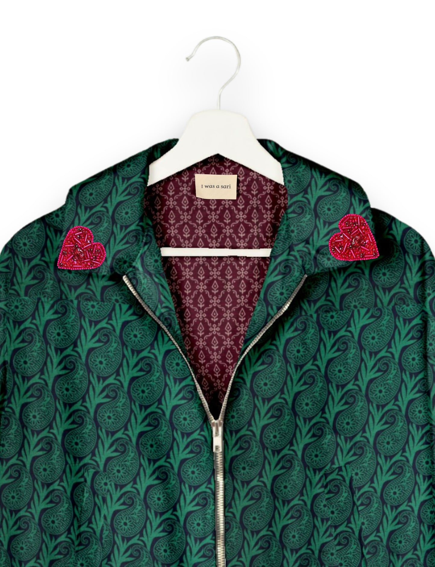 Make a bold statement with our Heart Drop Earrings, a symbol of conscious luxury and ethical fashion. Handcrafted using the intricate Aari embroidery technique, these earrings are made from upcycled sari fabric, embracing slow fashion and zero waste clothing. Elevate your look with sustainable apparel that supports fair trade fashion while reducing textile waste. Choose eco-friendly fashion that speaks of love, artistry, and responsibility.