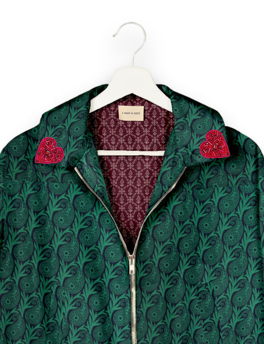 Make a bold statement with our Heart Drop Earrings, a symbol of conscious luxury and ethical fashion. Handcrafted using the intricate Aari embroidery technique, these earrings are made from upcycled sari fabric, embracing slow fashion and zero waste clothing. Elevate your look with sustainable apparel that supports fair trade fashion while reducing textile waste. Choose eco-friendly fashion that speaks of love, artistry, and responsibility.