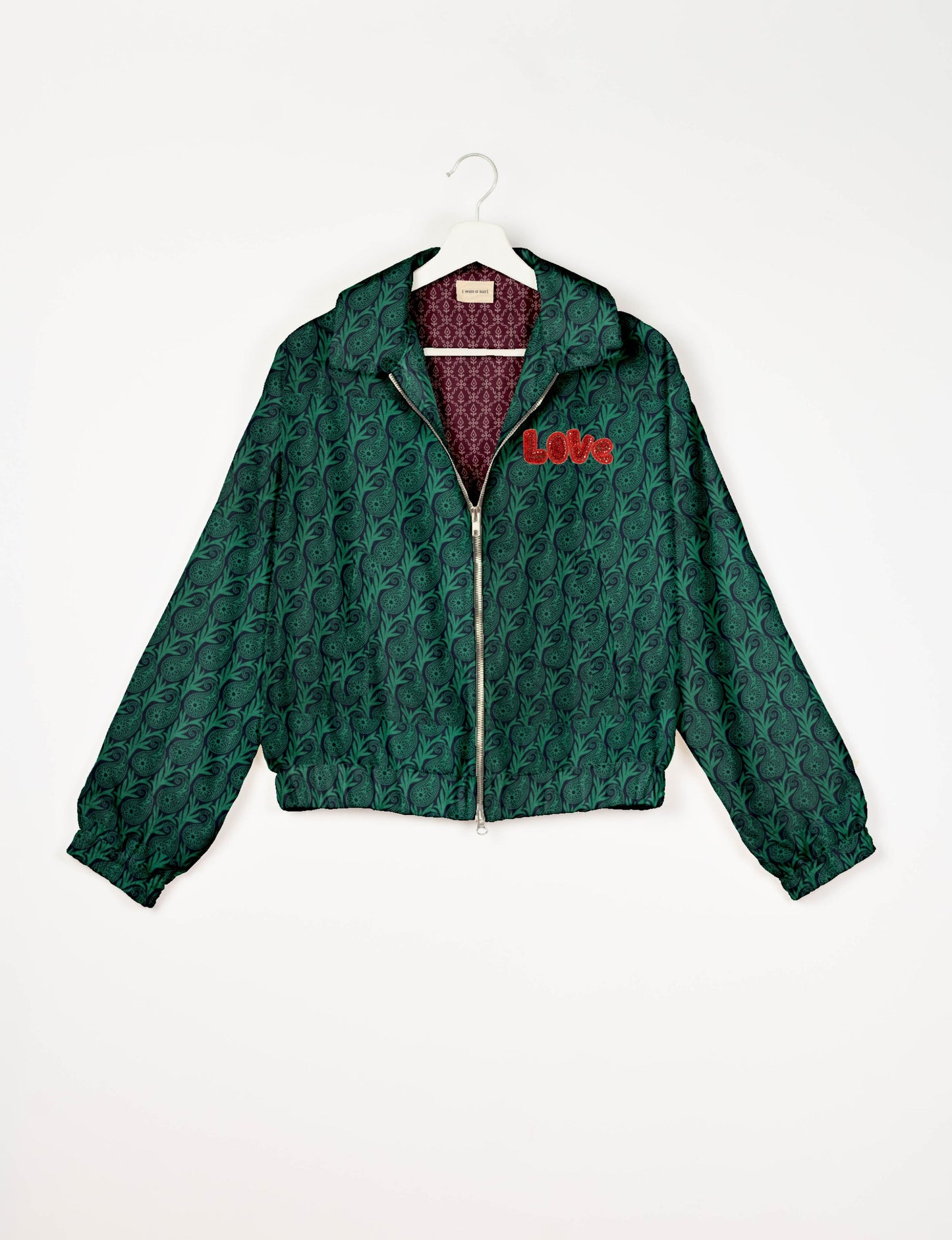 Love Bomber Jacket made from recycled fabric, featuring hand-stitched Aari embroidery. A unique piece of zero-waste clothing, part of the circular fashion movement. Designed with upcycled materials for a stylish yet environmentally friendly clothing choice.