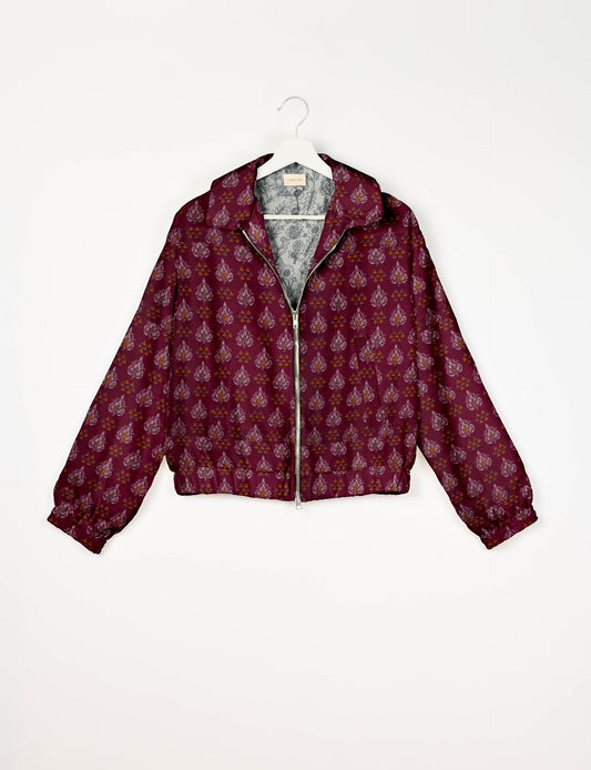 Upcycled Bomber Jacket made from recycled sari materials, featuring a cute cropped shape, elasticated hem and cuffs, and contrast sari print lining. Sustainable apparel promoting eco-friendly fashion and ethical clothing.