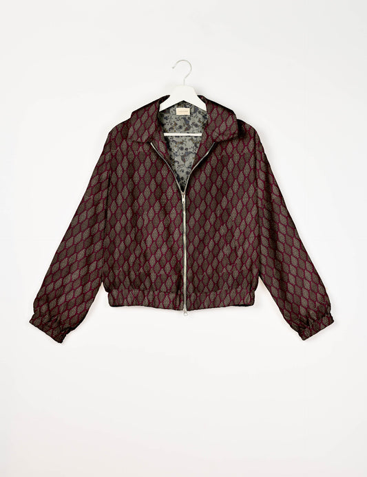 Upcycled Bomber Jacket made from recycled sari materials, featuring a cute cropped shape, elasticated hem and cuffs, and contrast sari print lining. Sustainable apparel promoting eco-friendly fashion and ethical clothing.