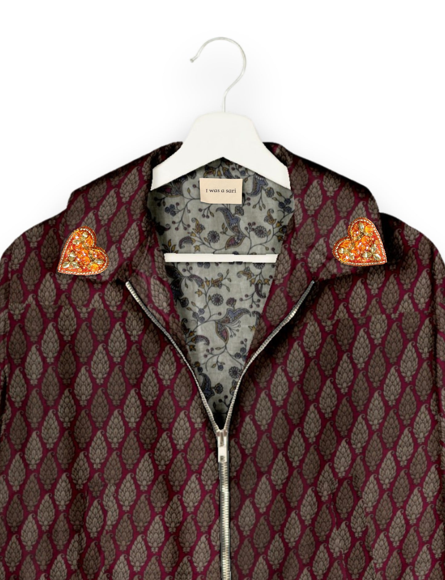 Make a bold statement with our Heart Drop Earrings, a symbol of conscious luxury and ethical fashion. Handcrafted using the intricate Aari embroidery technique, these earrings are made from upcycled sari fabric, embracing slow fashion and zero waste clothing. Elevate your look with sustainable apparel that supports fair trade fashion while reducing textile waste. Choose eco-friendly fashion that speaks of love, artistry, and responsibility.