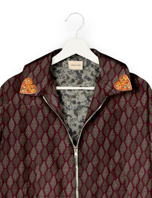 Make a bold statement with our Heart Drop Earrings, a symbol of conscious luxury and ethical fashion. Handcrafted using the intricate Aari embroidery technique, these earrings are made from upcycled sari fabric, embracing slow fashion and zero waste clothing. Elevate your look with sustainable apparel that supports fair trade fashion while reducing textile waste. Choose eco-friendly fashion that speaks of love, artistry, and responsibility.