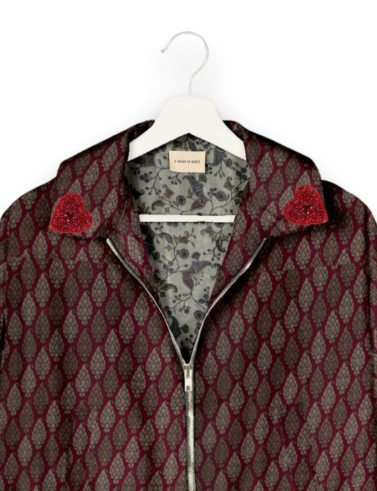 Make a bold statement with our Heart Drop Earrings, a symbol of conscious luxury and ethical fashion. Handcrafted using the intricate Aari embroidery technique, these earrings are made from upcycled sari fabric, embracing slow fashion and zero waste clothing. Elevate your look with sustainable apparel that supports fair trade fashion while reducing textile waste. Choose eco-friendly fashion that speaks of love, artistry, and responsibility.