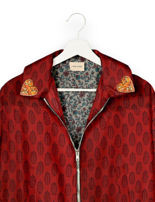 Make a bold statement with our Heart Drop Earrings, a symbol of conscious luxury and ethical fashion. Handcrafted using the intricate Aari embroidery technique, these earrings are made from upcycled sari fabric, embracing slow fashion and zero waste clothing. Elevate your look with sustainable apparel that supports fair trade fashion while reducing textile waste. Choose eco-friendly fashion that speaks of love, artistry, and responsibility.