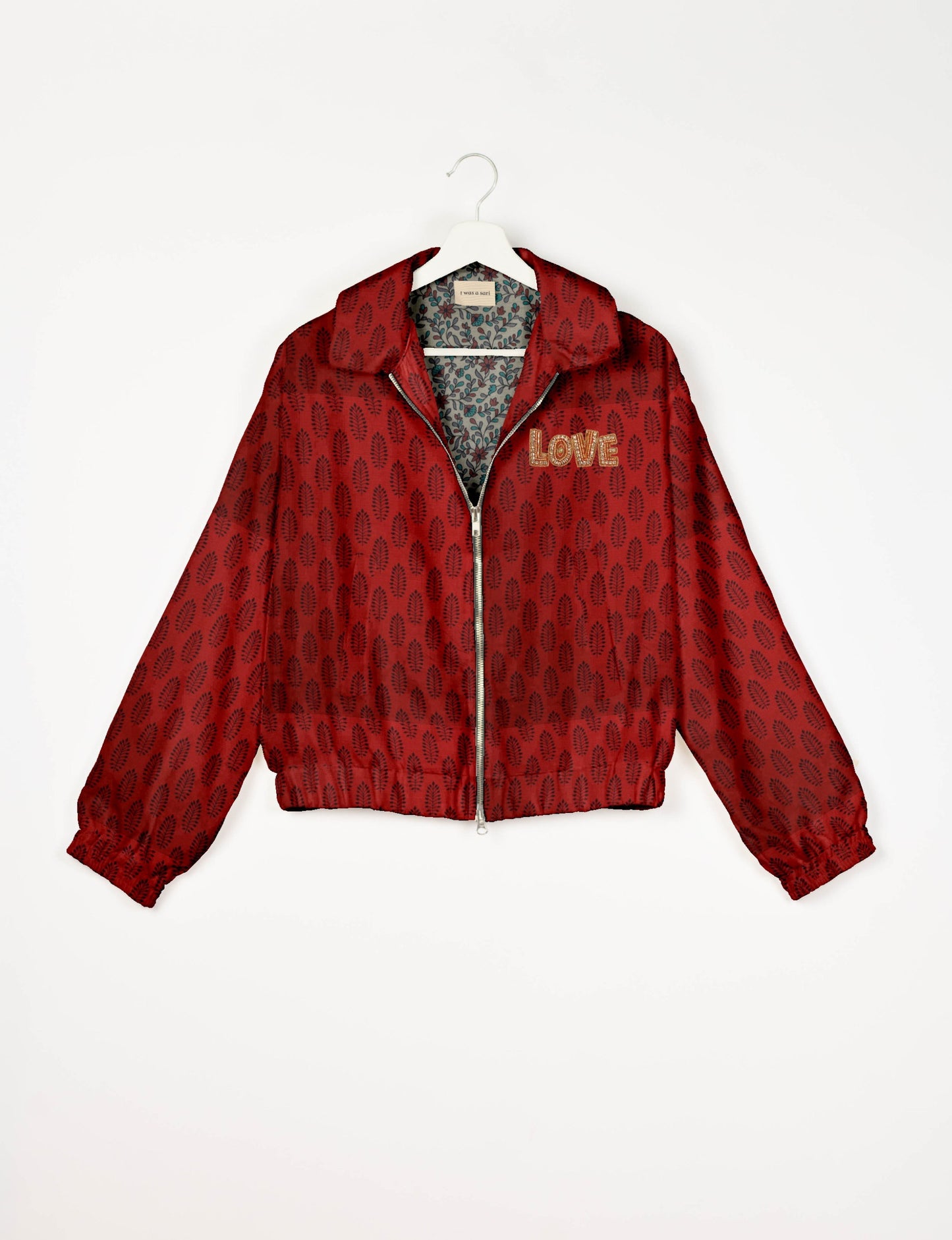 Love Bomber Jacket made from recycled fabric, featuring hand-stitched Aari embroidery. A unique piece of zero-waste clothing, part of the circular fashion movement. Designed with upcycled materials for a stylish yet environmentally friendly clothing choice.