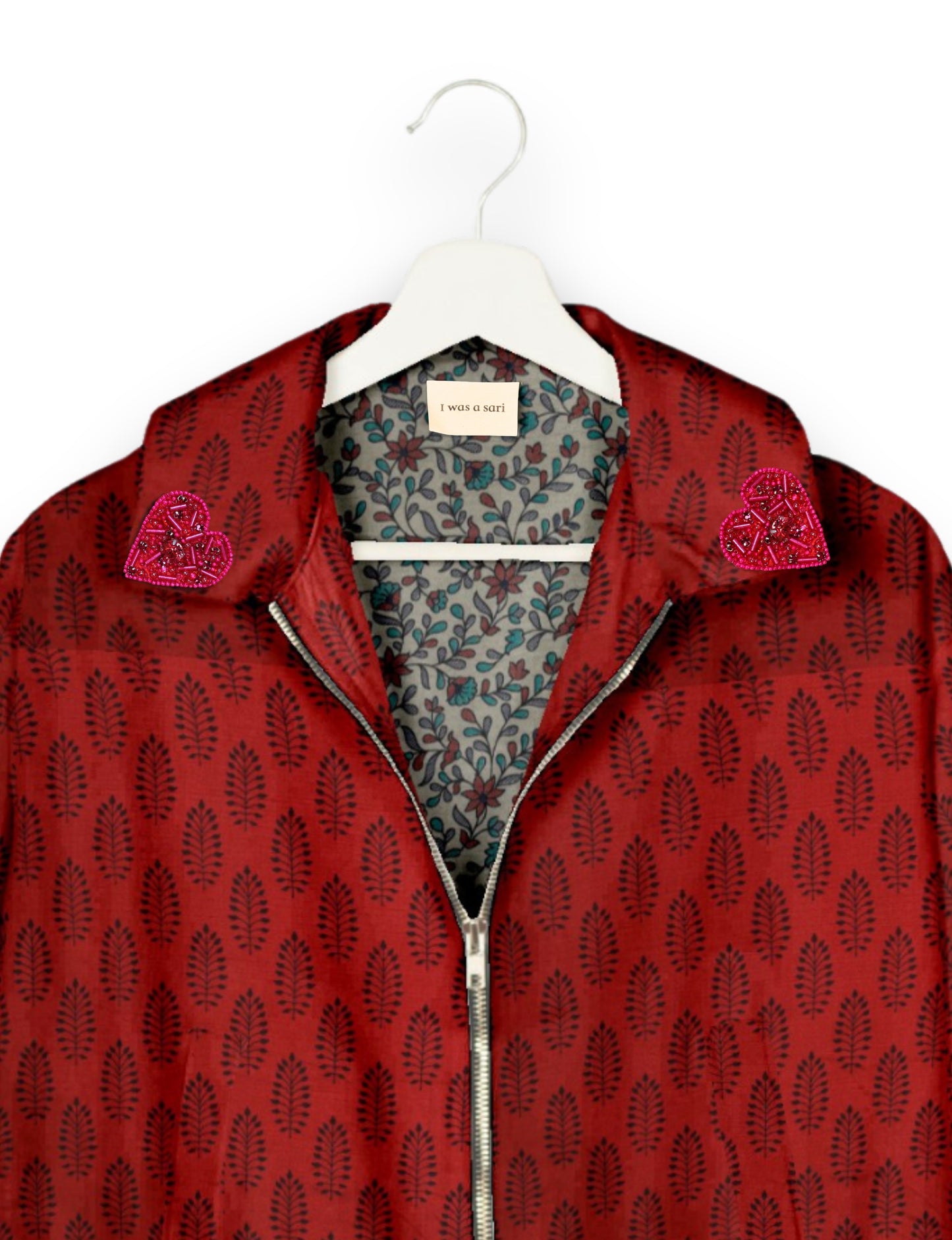 Make a bold statement with our Heart Drop Earrings, a symbol of conscious luxury and ethical fashion. Handcrafted using the intricate Aari embroidery technique, these earrings are made from upcycled sari fabric, embracing slow fashion and zero waste clothing. Elevate your look with sustainable apparel that supports fair trade fashion while reducing textile waste. Choose eco-friendly fashion that speaks of love, artistry, and responsibility.