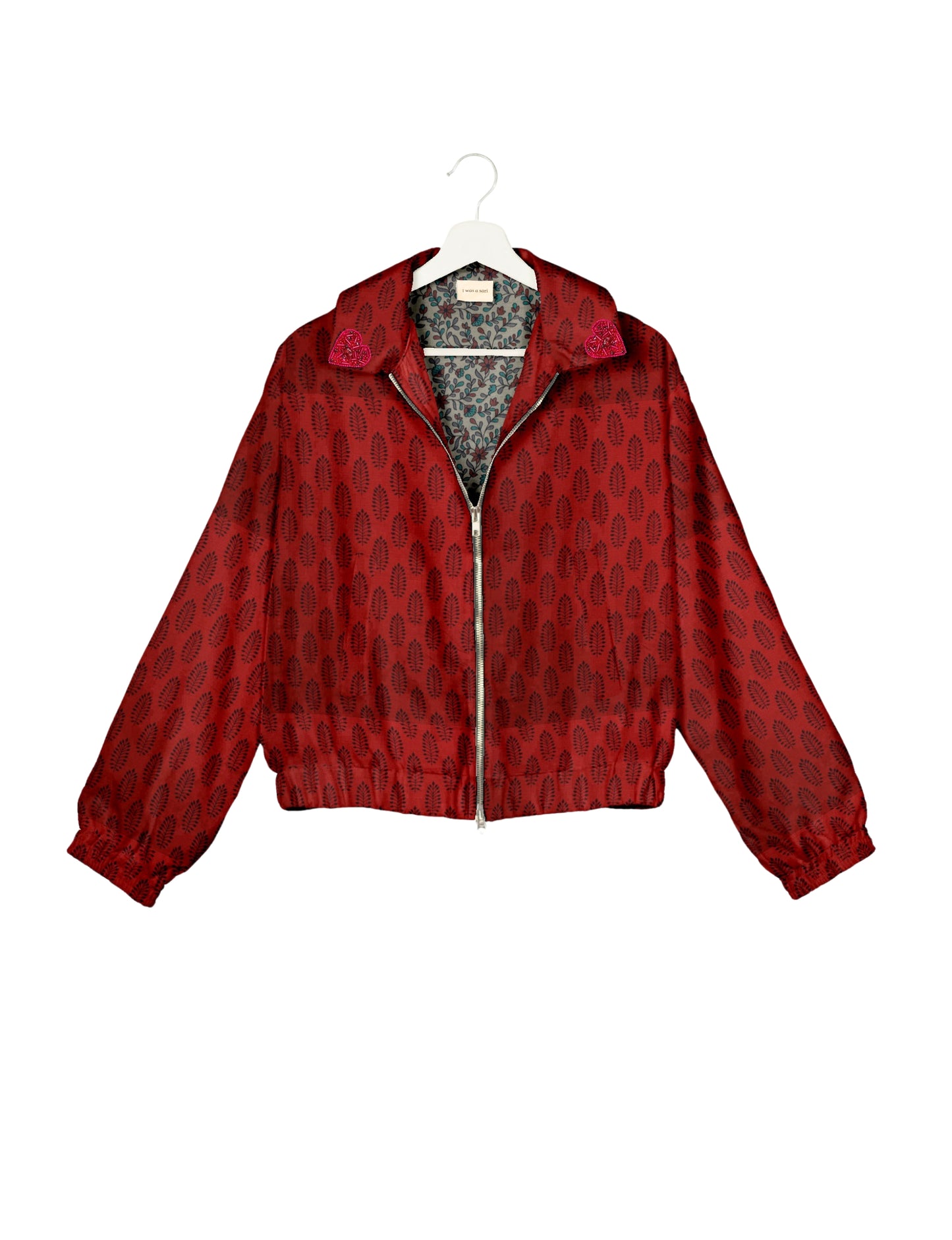 Make a bold statement with our Heart Drop Earrings, a symbol of conscious luxury and ethical fashion. Handcrafted using the intricate Aari embroidery technique, these earrings are made from upcycled sari fabric, embracing slow fashion and zero waste clothing. Elevate your look with sustainable apparel that supports fair trade fashion while reducing textile waste. Choose eco-friendly fashion that speaks of love, artistry, and responsibility.