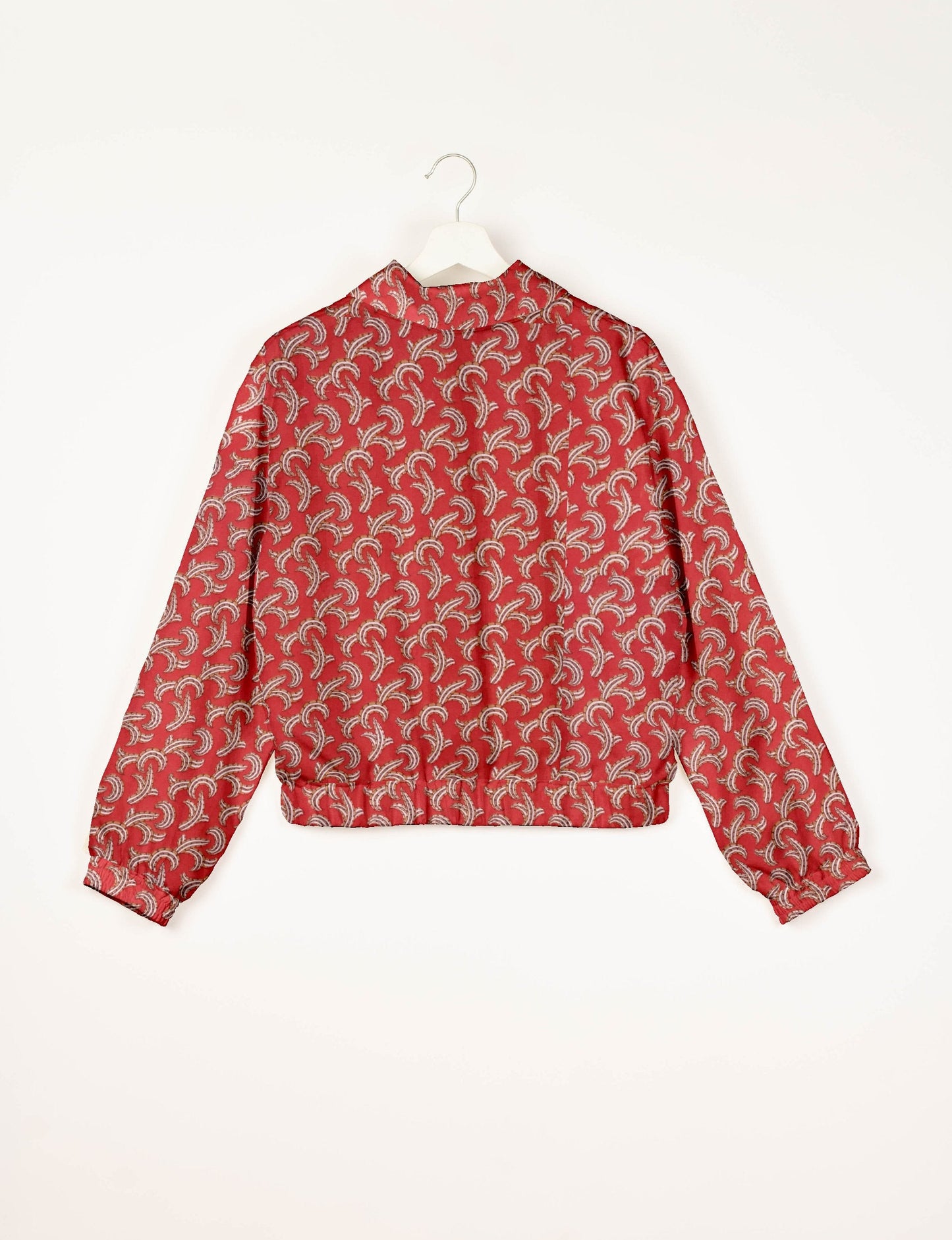 Stylish BOMBER JACKET, an upcycled clothing masterpiece with a cute cropped shape, elasticated details, and detachable metallic zipper. Contrast sari print lining adds a unique touch. Explore sustainable and eco-friendly fashion.