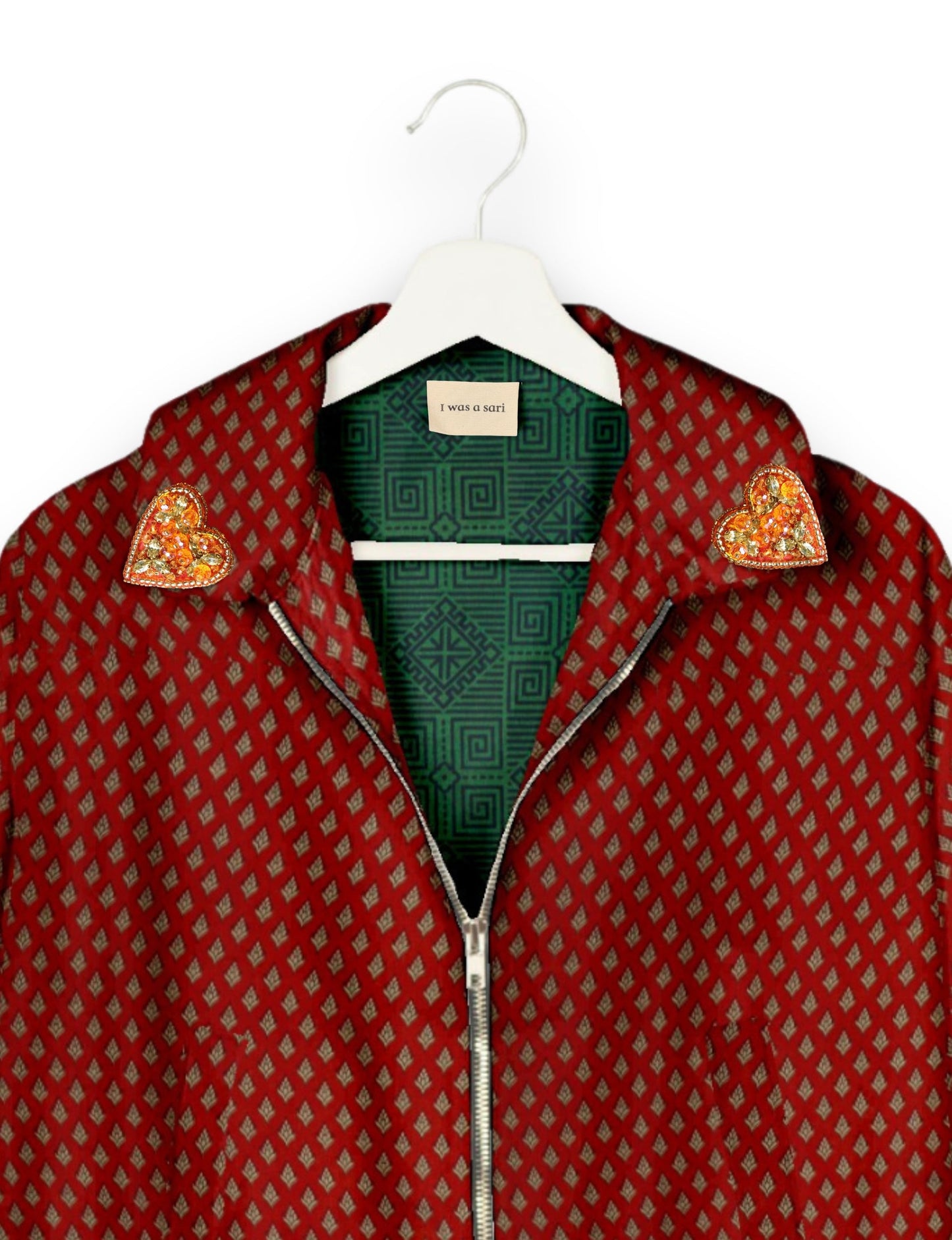 Make a bold statement with our Heart Drop Earrings, a symbol of conscious luxury and ethical fashion. Handcrafted using the intricate Aari embroidery technique, these earrings are made from upcycled sari fabric, embracing slow fashion and zero waste clothing. Elevate your look with sustainable apparel that supports fair trade fashion while reducing textile waste. Choose eco-friendly fashion that speaks of love, artistry, and responsibility.