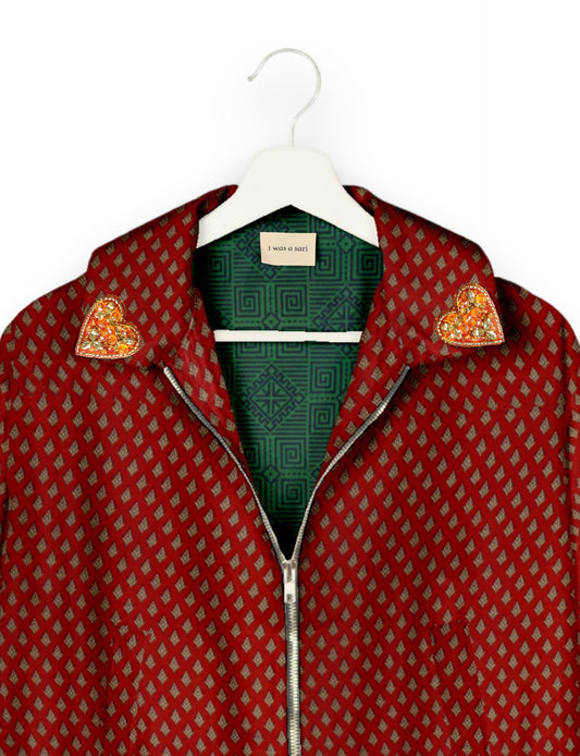 Make a bold statement with our Heart Drop Earrings, a symbol of conscious luxury and ethical fashion. Handcrafted using the intricate Aari embroidery technique, these earrings are made from upcycled sari fabric, embracing slow fashion and zero waste clothing. Elevate your look with sustainable apparel that supports fair trade fashion while reducing textile waste. Choose eco-friendly fashion that speaks of love, artistry, and responsibility.