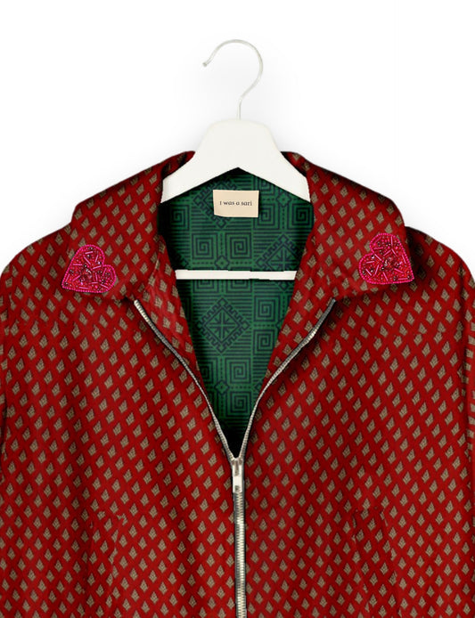 Make a bold statement with our Heart Drop Earrings, a symbol of conscious luxury and ethical fashion. Handcrafted using the intricate Aari embroidery technique, these earrings are made from upcycled sari fabric, embracing slow fashion and zero waste clothing. Elevate your look with sustainable apparel that supports fair trade fashion while reducing textile waste. Choose eco-friendly fashion that speaks of love, artistry, and responsibility.