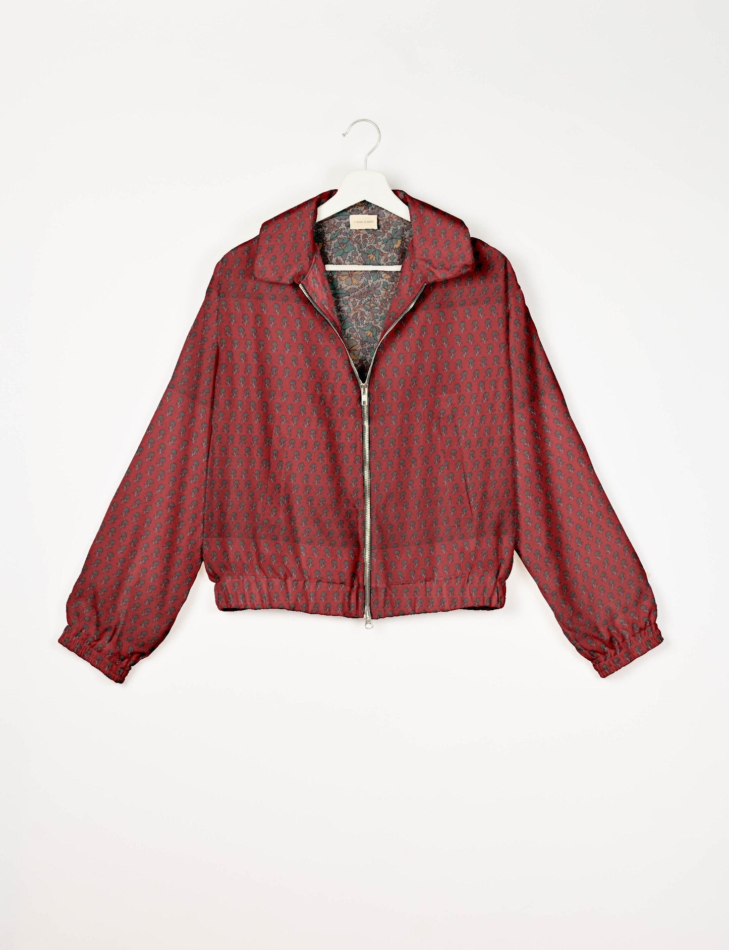 Upcycled Bomber Jacket made from recycled sari materials, featuring a cute cropped shape, elasticated hem and cuffs, and contrast sari print lining. Sustainable apparel promoting eco-friendly fashion and ethical clothing.