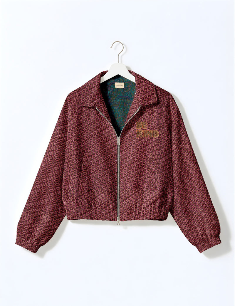 BE KIND Bomber jacket made from upcycled sari fabric with handcrafted Aari embroidery by female artisans.