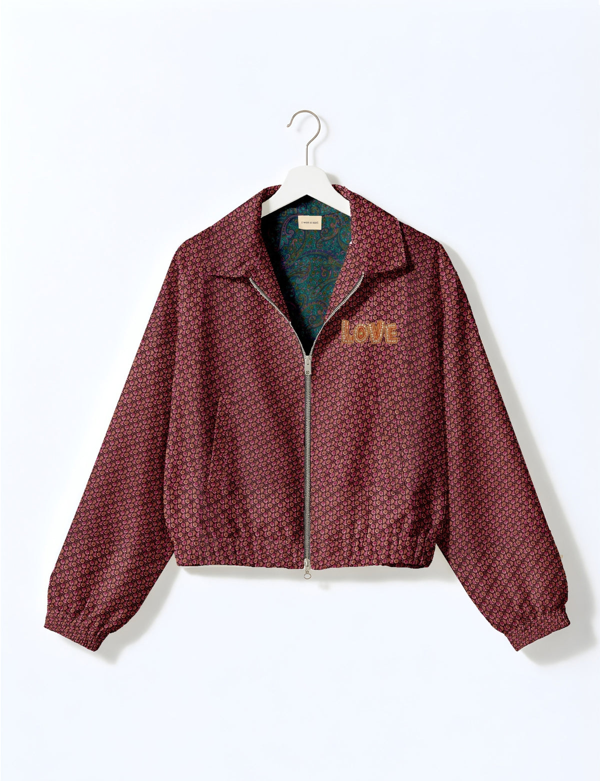 Love Bomber Jacket made from recycled fabric, featuring hand-stitched Aari embroidery. A unique piece of zero-waste clothing, part of the circular fashion movement. Designed with upcycled materials for a stylish yet environmentally friendly clothing choice.