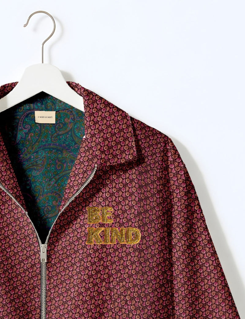 BE KIND Bomber jacket made from upcycled sari fabric with handcrafted Aari embroidery by female artisans.