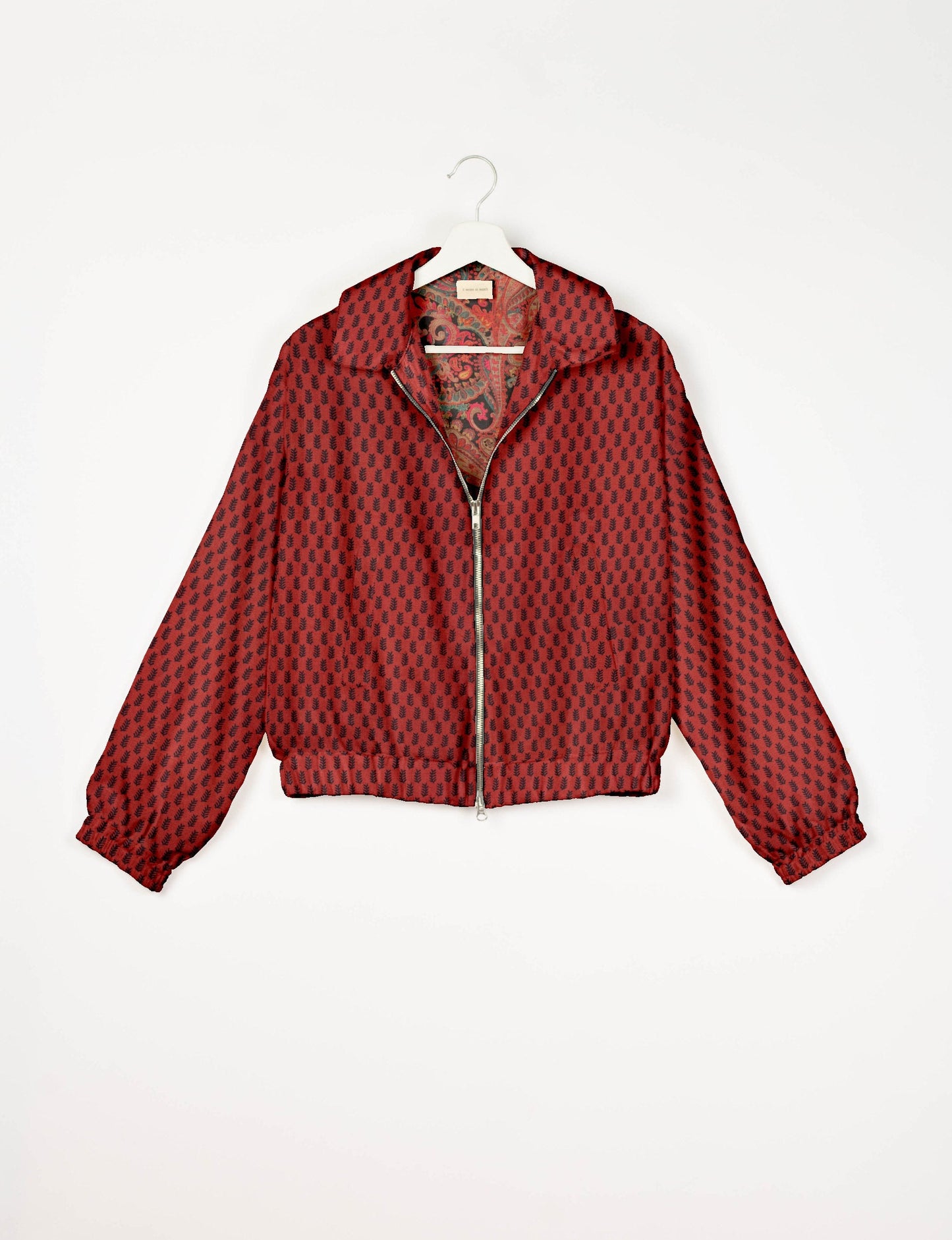 Upcycled Bomber Jacket made from recycled sari materials, featuring a cute cropped shape, elasticated hem and cuffs, and contrast sari print lining. Sustainable apparel promoting eco-friendly fashion and ethical clothing.