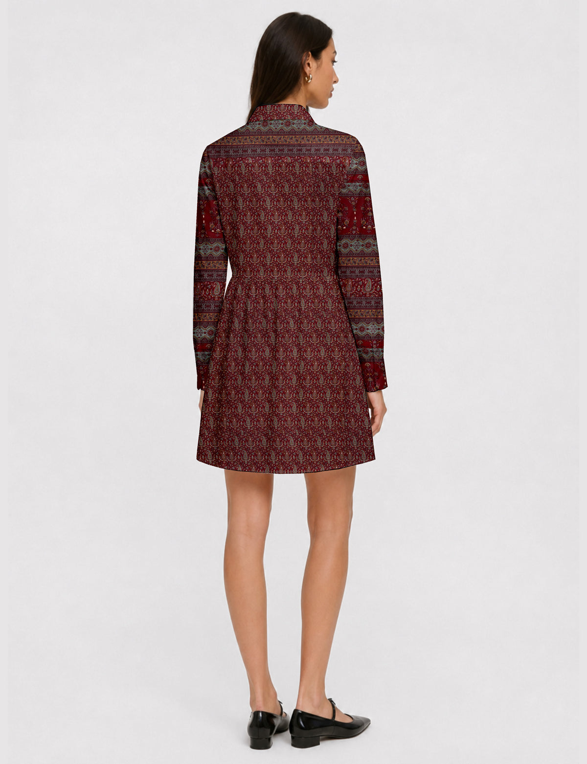 Short shirt dress with a relaxed A-line silhouette, point collar, partial button placket, gathered waist, side pockets, and full-length cuffed sleeves.