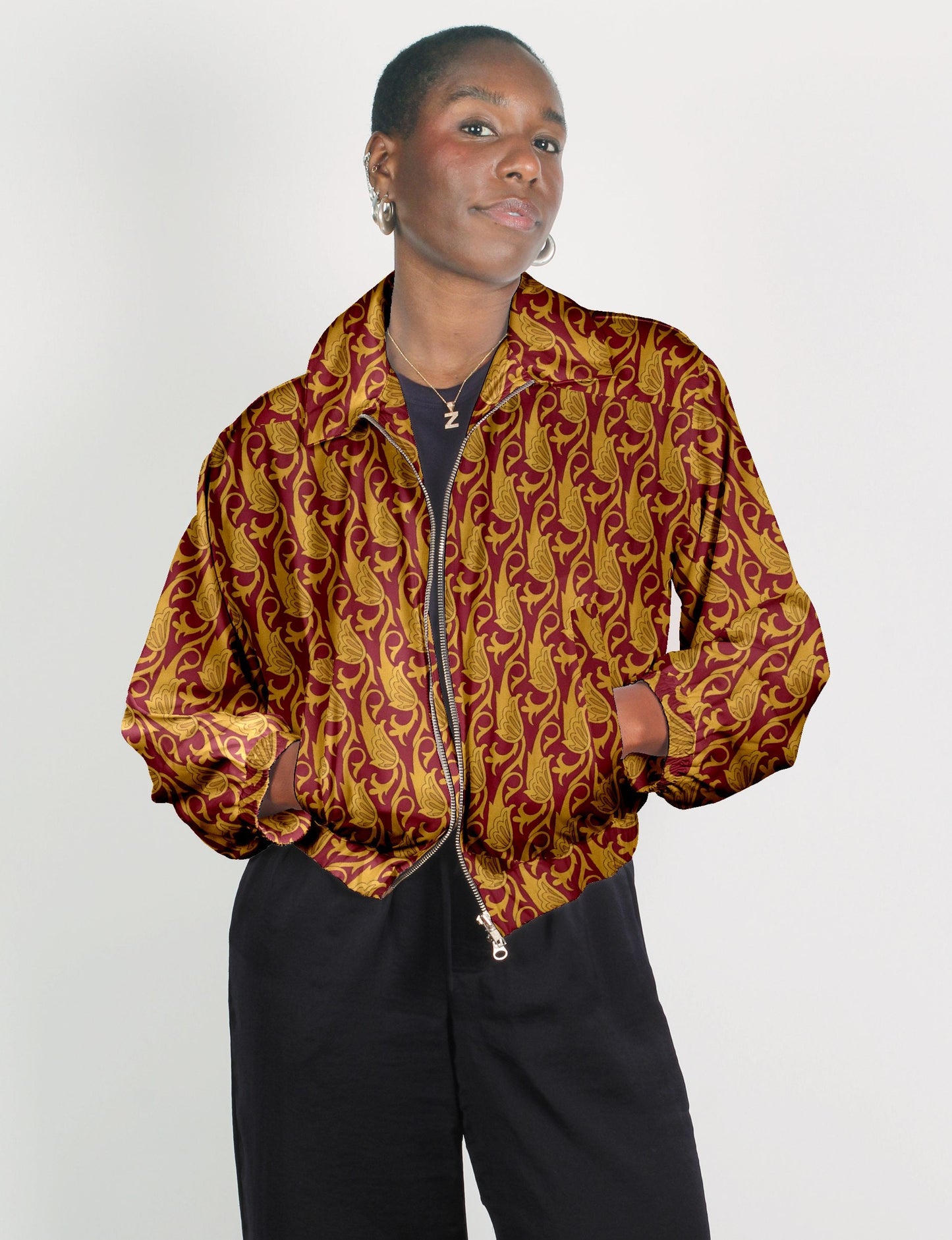 Stylish BOMBER JACKET, an upcycled clothing masterpiece with a cute cropped shape, elasticated details, and detachable metallic zipper. Contrast sari print lining adds a unique touch. Explore sustainable and eco-friendly fashion.