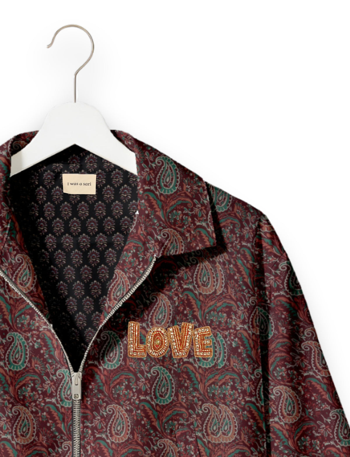 Love Bomber Jacket made from recycled fabric, featuring hand-stitched Aari embroidery. A unique piece of zero-waste clothing, part of the circular fashion movement. Designed with upcycled materials for a stylish yet environmentally friendly clothing choice.