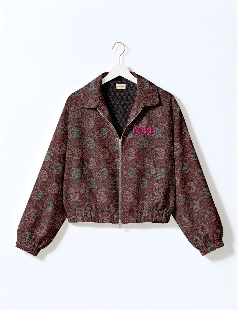 Love Bomber Jacket made from recycled fabric, featuring hand-stitched Aari embroidery. A unique piece of zero-waste clothing, part of the circular fashion movement. Designed with upcycled materials for a stylish yet environmentally friendly clothing choice.