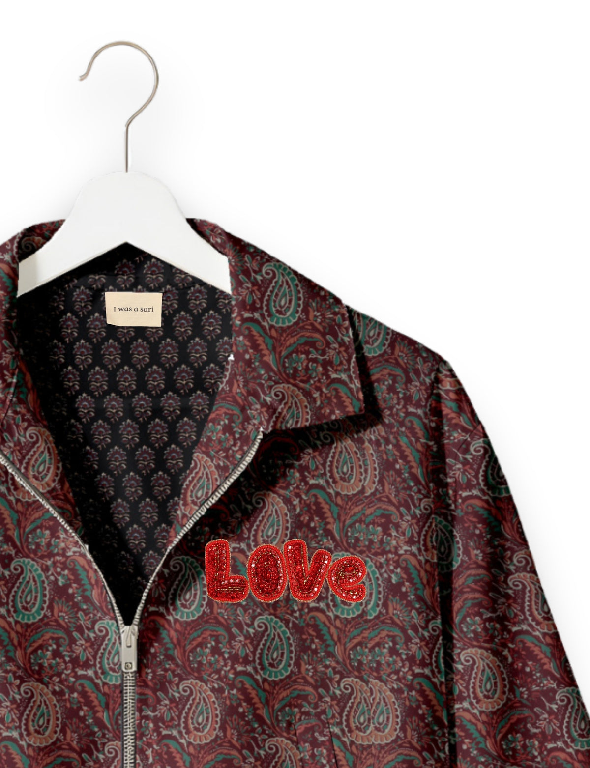 Love Bomber Jacket made from recycled fabric, featuring hand-stitched Aari embroidery. A unique piece of zero-waste clothing, part of the circular fashion movement. Designed with upcycled materials for a stylish yet environmentally friendly clothing choice.