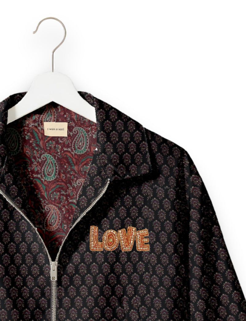 Love Bomber Jacket made from recycled fabric, featuring hand-stitched Aari embroidery. A unique piece of zero-waste clothing, part of the circular fashion movement. Designed with upcycled materials for a stylish yet environmentally friendly clothing choice.