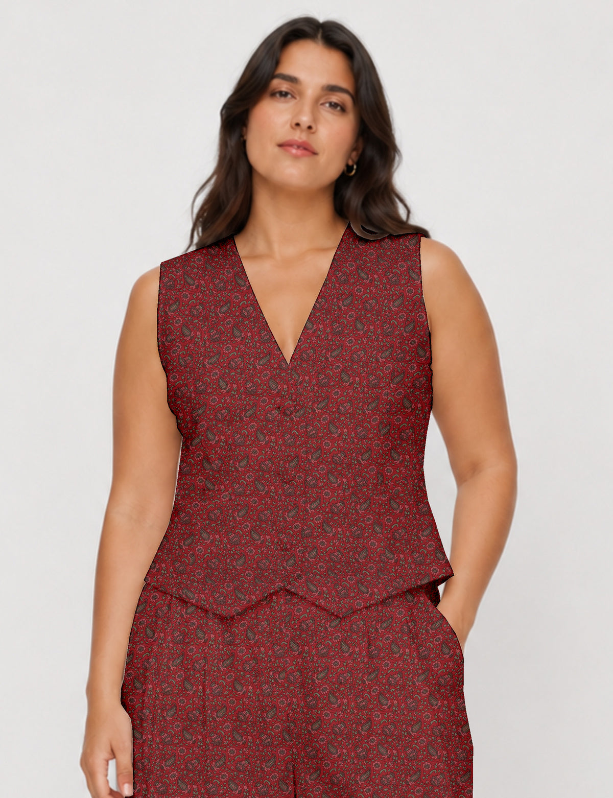 Women's fitted waistcoat with V-neck, single-breasted button closure, tailored silhouette, and pointed hem in sustainable fashion.