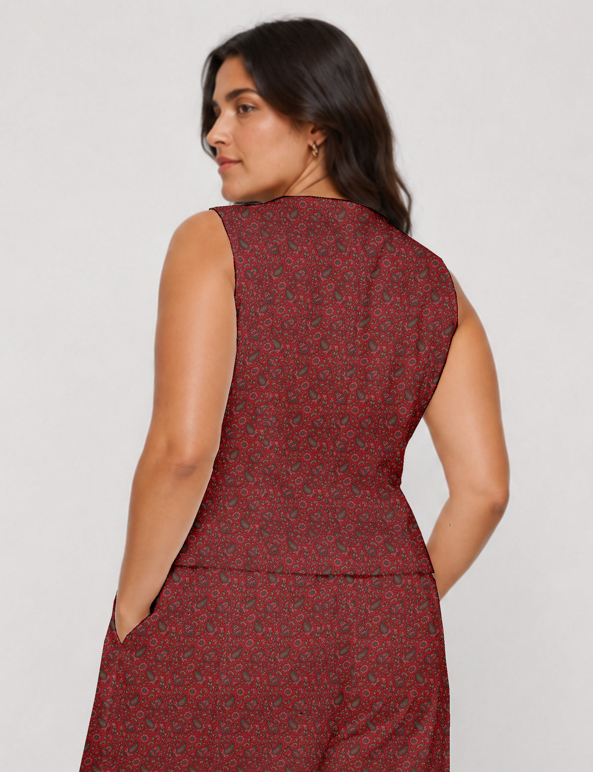 Women's fitted waistcoat with V-neck, single-breasted button closure, tailored silhouette, and pointed hem in sustainable fashion.