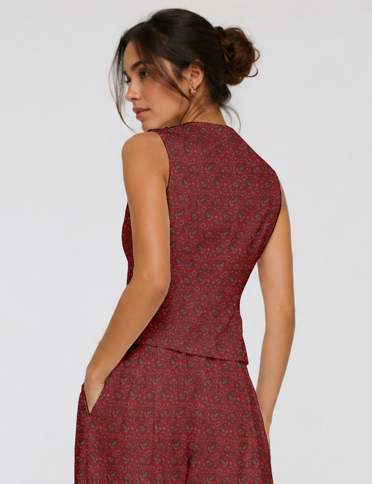 Women's fitted waistcoat with V-neck, single-breasted button closure, tailored silhouette, and pointed hem in sustainable fashion.