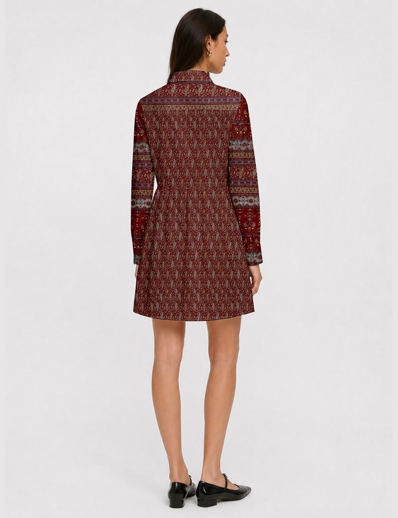 Short shirt dress with a relaxed A-line silhouette, point collar, partial button placket, gathered waist, side pockets, and full-length cuffed sleeves.