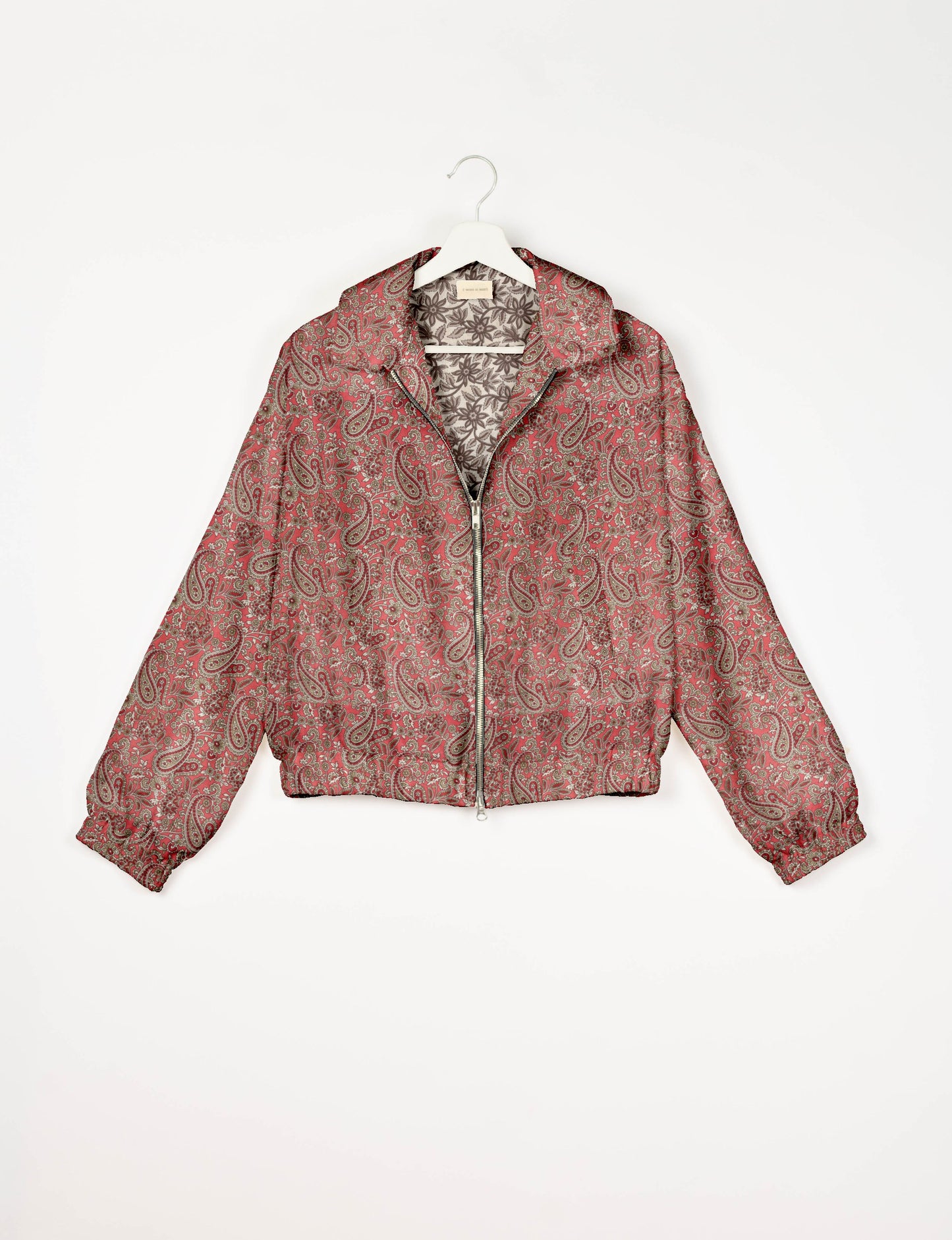 Upcycled Bomber Jacket made from recycled sari materials, featuring a cute cropped shape, elasticated hem and cuffs, and contrast sari print lining. Sustainable apparel promoting eco-friendly fashion and ethical clothing.