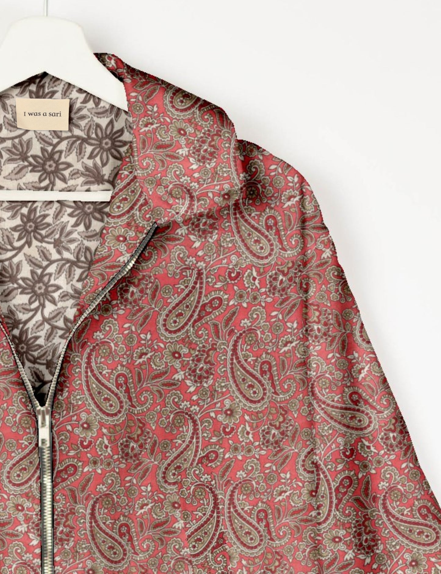 Upcycled Bomber Jacket made from recycled sari materials, featuring a cute cropped shape, elasticated hem and cuffs, and contrast sari print lining. Sustainable apparel promoting eco-friendly fashion and ethical clothing.