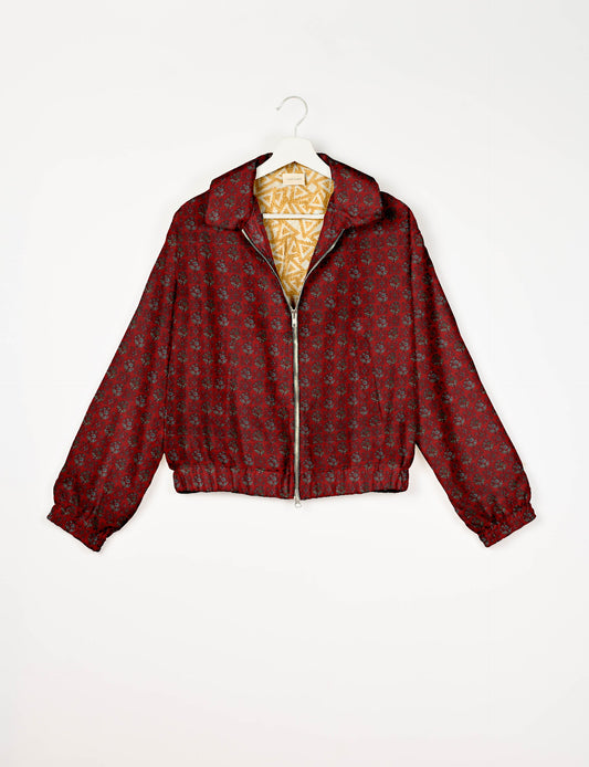 Upcycled Bomber Jacket made from recycled sari materials, featuring a cute cropped shape, elasticated hem and cuffs, and contrast sari print lining. Sustainable apparel promoting eco-friendly fashion and ethical clothing.
