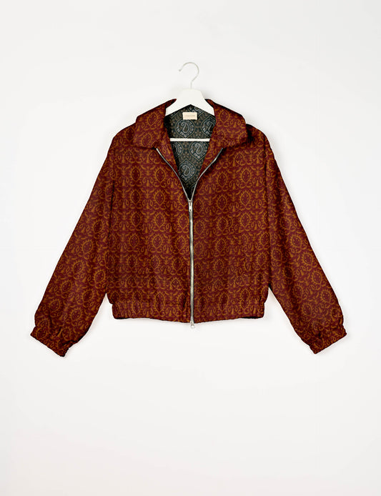 Upcycled Bomber Jacket made from recycled sari materials, featuring a cute cropped shape, elasticated hem and cuffs, and contrast sari print lining. Sustainable apparel promoting eco-friendly fashion and ethical clothing.
