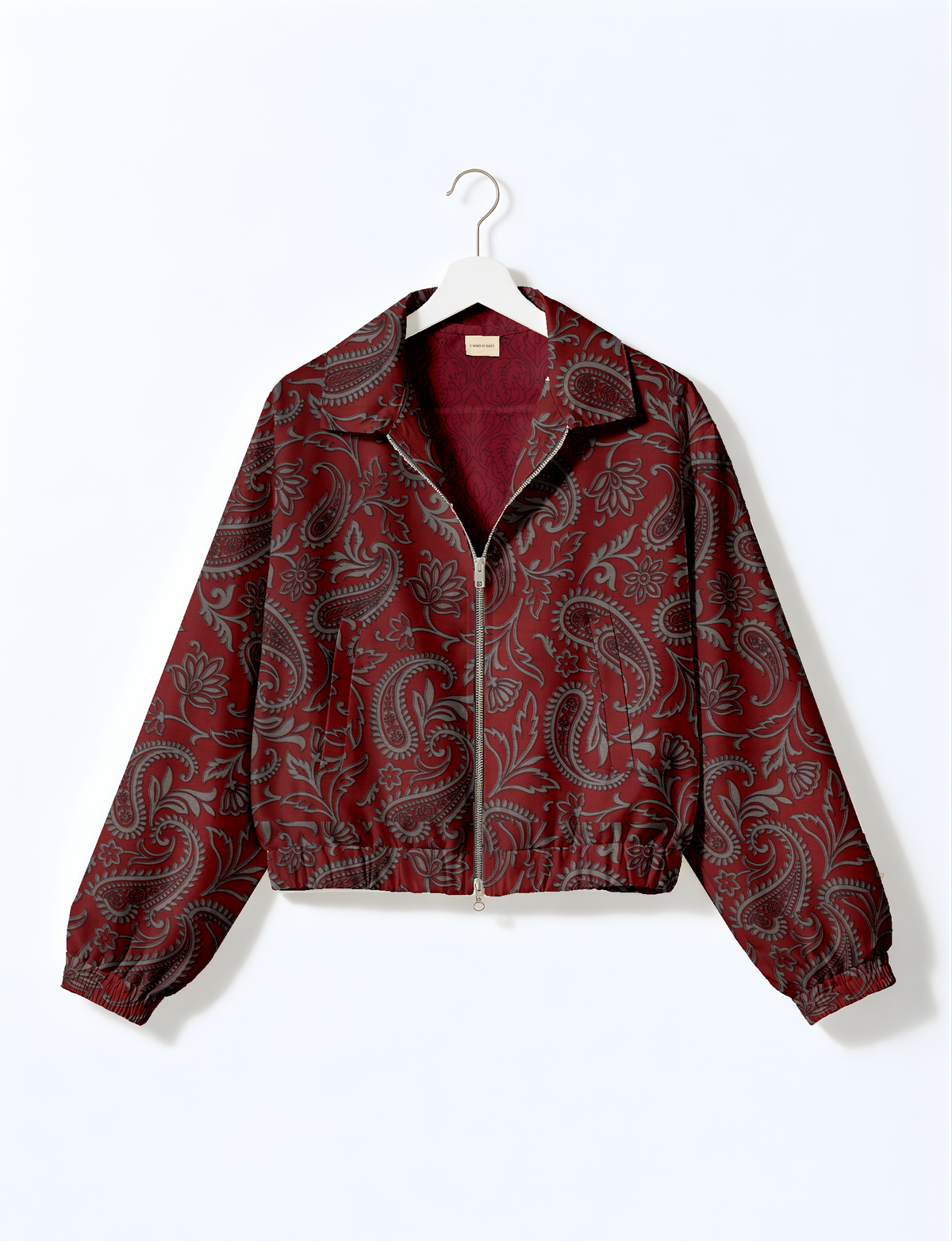 Upcycled Bomber Jacket made from recycled sari materials, featuring a cute cropped shape, elasticated hem and cuffs, and contrast sari print lining. Sustainable apparel promoting eco-friendly fashion and ethical clothing.