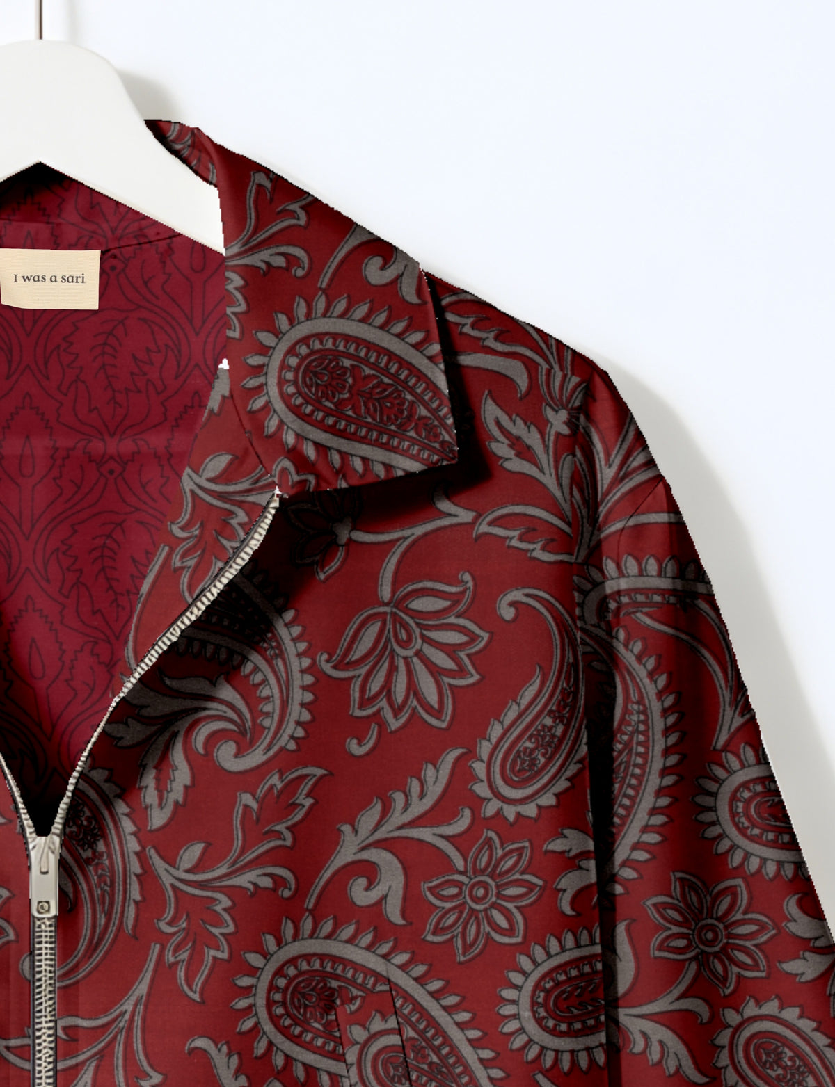Upcycled Bomber Jacket made from recycled sari materials, featuring a cute cropped shape, elasticated hem and cuffs, and contrast sari print lining. Sustainable apparel promoting eco-friendly fashion and ethical clothing.