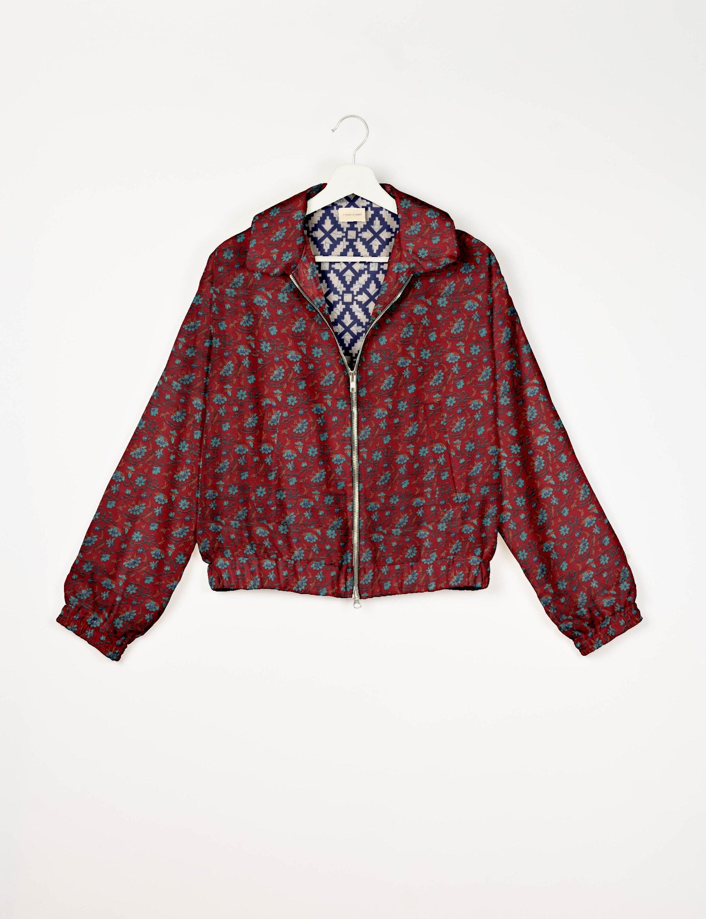 Upcycled Bomber Jacket made from recycled sari materials, featuring a cute cropped shape, elasticated hem and cuffs, and contrast sari print lining. Sustainable apparel promoting eco-friendly fashion and ethical clothing.