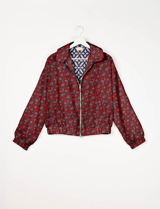 Upcycled Bomber Jacket made from recycled sari materials, featuring a cute cropped shape, elasticated hem and cuffs, and contrast sari print lining. Sustainable apparel promoting eco-friendly fashion and ethical clothing.