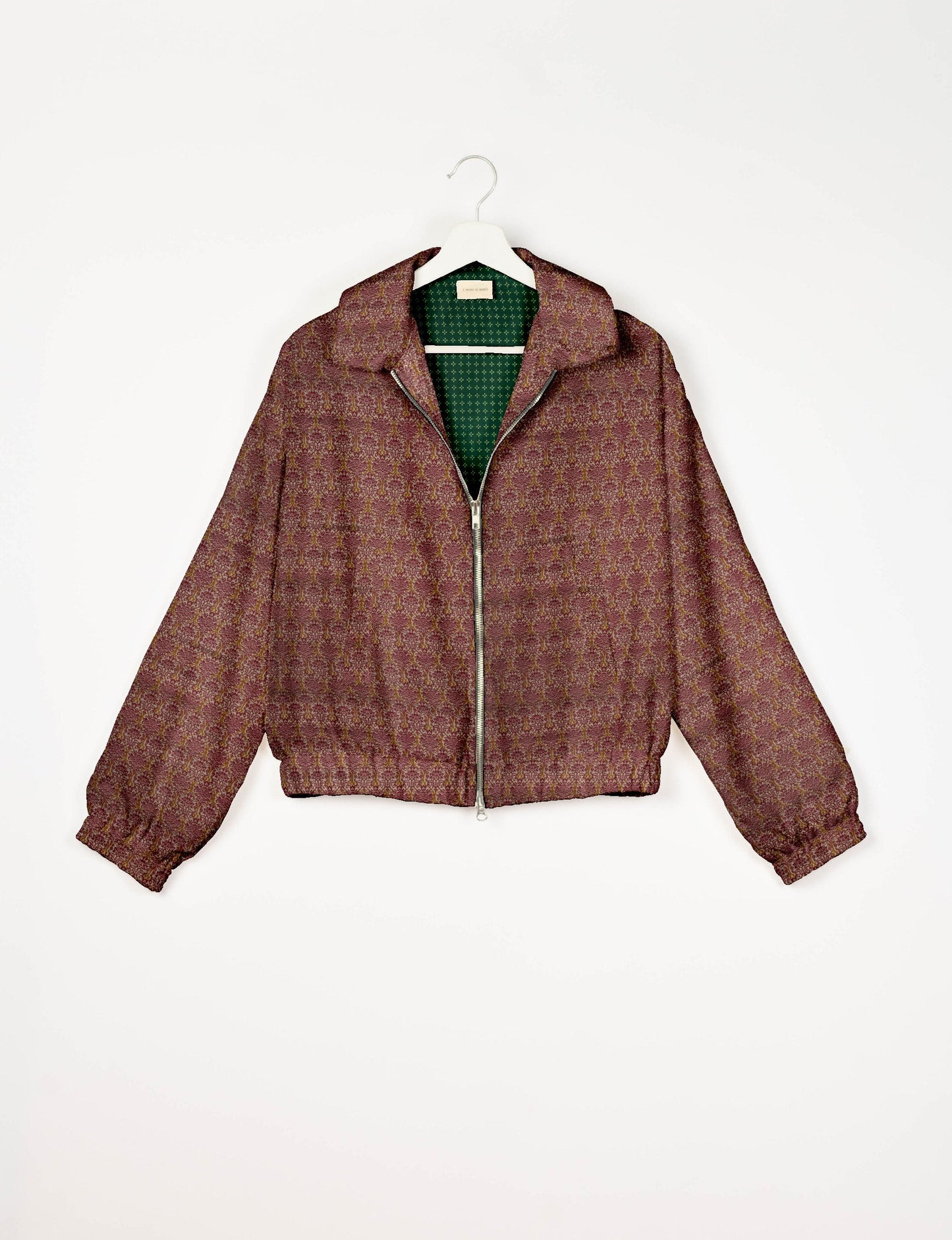 Upcycled Bomber Jacket made from recycled sari materials, featuring a cute cropped shape, elasticated hem and cuffs, and contrast sari print lining. Sustainable apparel promoting eco-friendly fashion and ethical clothing.