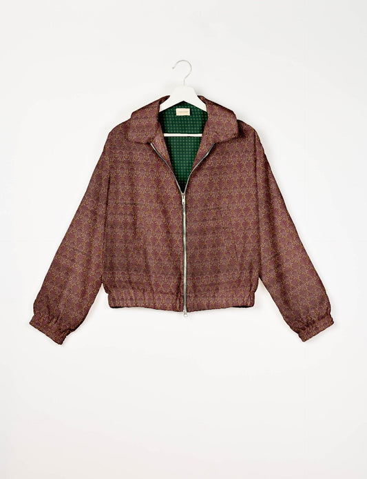 Upcycled Bomber Jacket made from recycled sari materials, featuring a cute cropped shape, elasticated hem and cuffs, and contrast sari print lining. Sustainable apparel promoting eco-friendly fashion and ethical clothing.