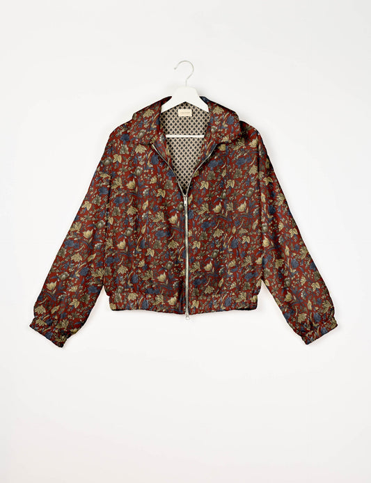 Upcycled Bomber Jacket made from recycled sari materials, featuring a cute cropped shape, elasticated hem and cuffs, and contrast sari print lining. Sustainable apparel promoting eco-friendly fashion and ethical clothing.