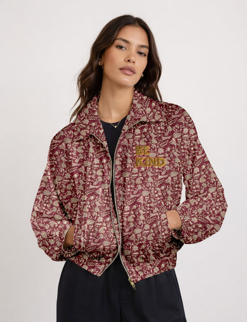 BE KIND Bomber jacket made from upcycled sari fabric with handcrafted Aari embroidery by female artisans.