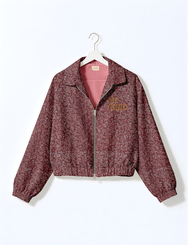 BE KIND Bomber jacket made from upcycled sari fabric with handcrafted Aari embroidery by female artisans.