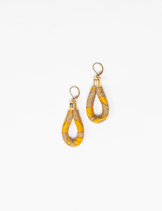 Elevate your style sustainably with our Rope Earrings. Crafted from cotton rope hand-wrapped with pre-loved saris, these earrings are a testament to ethical and green fashion. Make a conscious choice for a brighter, eco-friendly future.