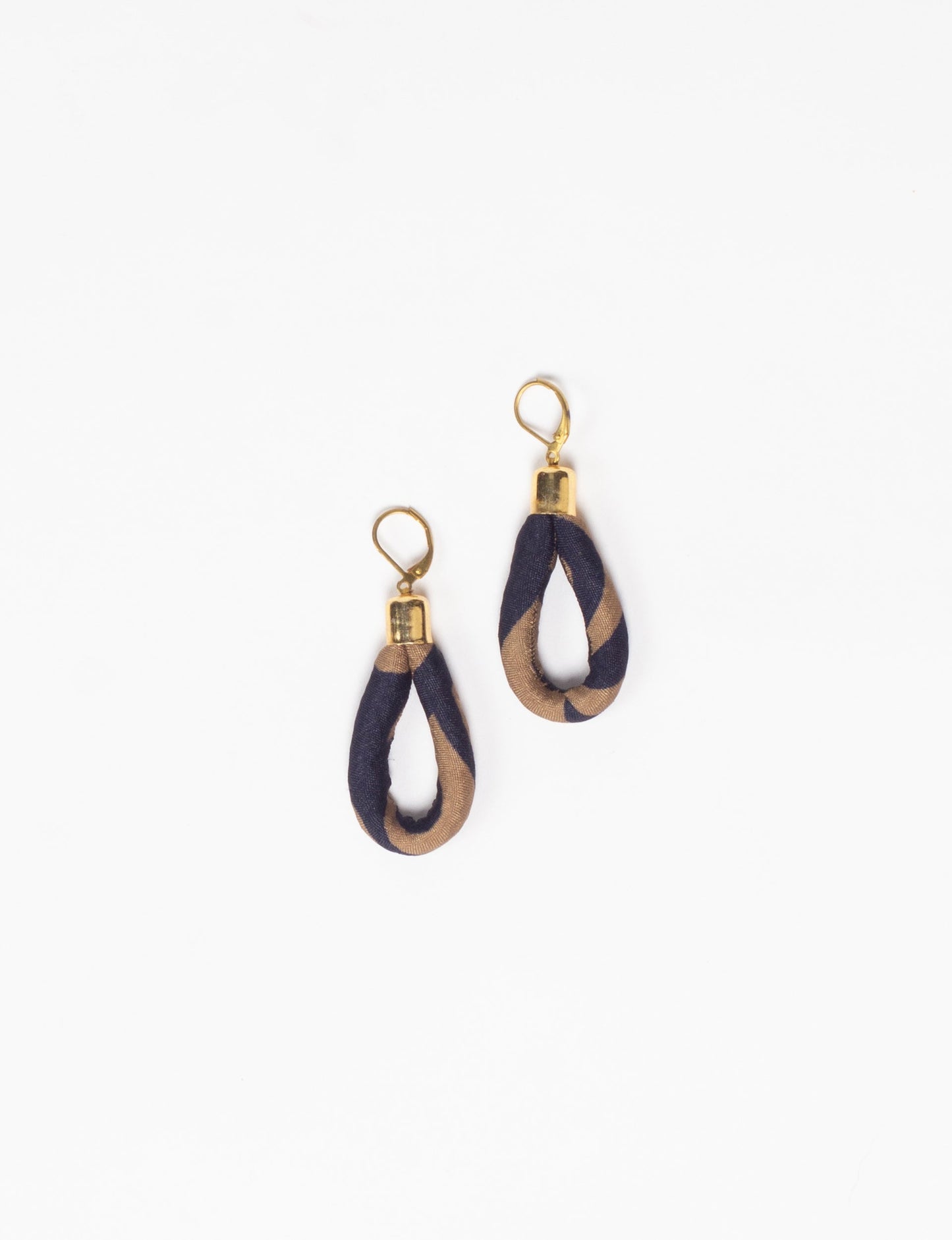 Elevate your style sustainably with our Rope Earrings. Crafted from cotton rope hand-wrapped with pre-loved saris, these earrings are a testament to ethical and green fashion. Make a conscious choice for a brighter, eco-friendly future.