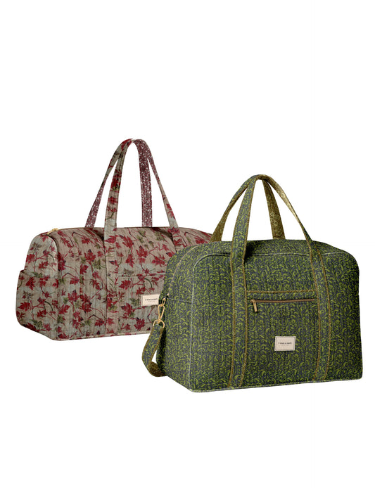 Twin travel bag set with quilted duffle and barrel bag by I was a Sari
Quilted duffle and barrel bag combo for short trips and travel
Matching quilted travel bag set with spacious storage and zip closure
Stylish quilted duffle and barrel bags for weekend getaways
I was a Sari twin travel bag set front view showing both bags
Quilted duffle and barrel bag side view highlighting size and design