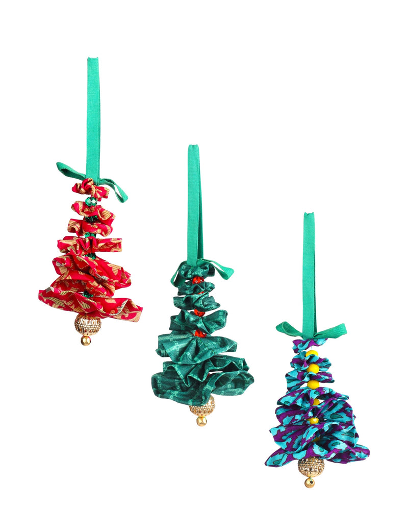 Set of three abstract fabric Christmas tree ornaments in red, green, and blue with green hanging loops and gold bead accents